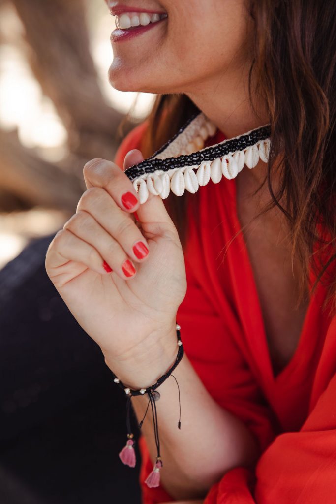 True Style Coach Leesa Whisker holding her happiness anchor necklace 