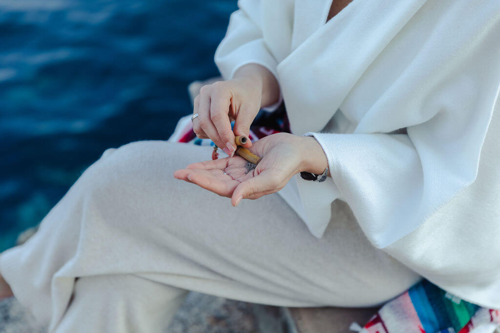 plant medicine healer doing rapé