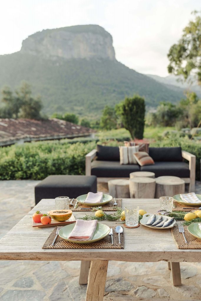 dinner table set on the terrace with gorgeous view of Alaro mountain