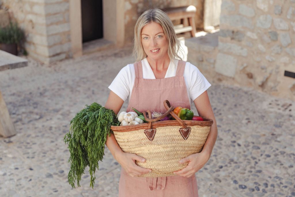 private chef Ida coming back from the market with basket full of fresh local products for her branding shoot