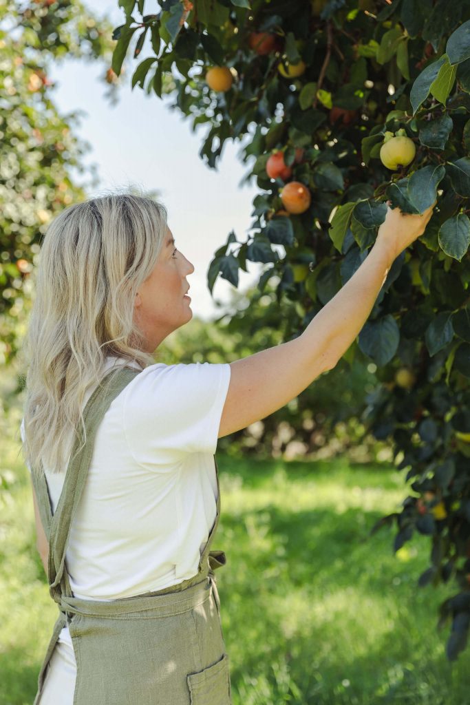 private chef Ida picking up local produce from garden during her personal branding shoot in Mallorca