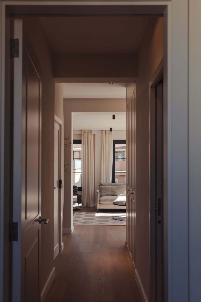 View from the bedroom to the living room to showcase the size of the penthouse for a real estate and interior design photography session.